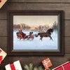 Framed One Horse Open Sleigh christmas art print next to gifts and garland on a rustic backdrop
